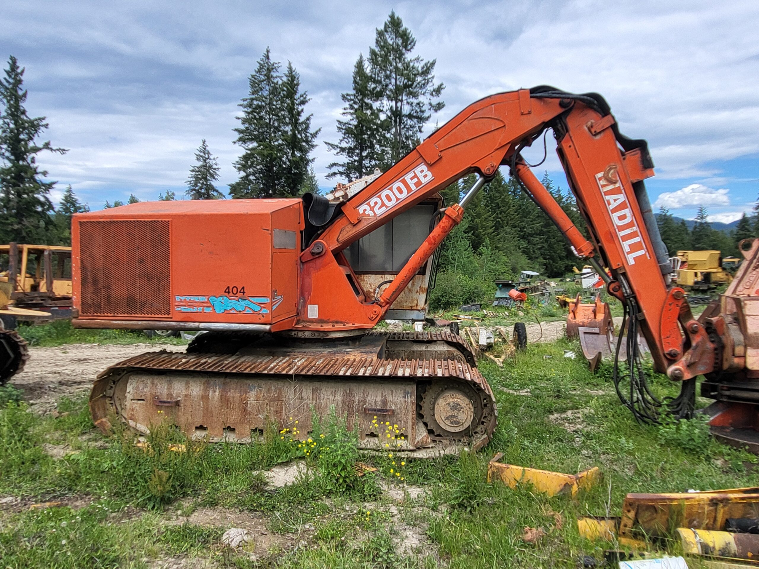 Madill 3200 Buncher with Quadco Full Rotating Head